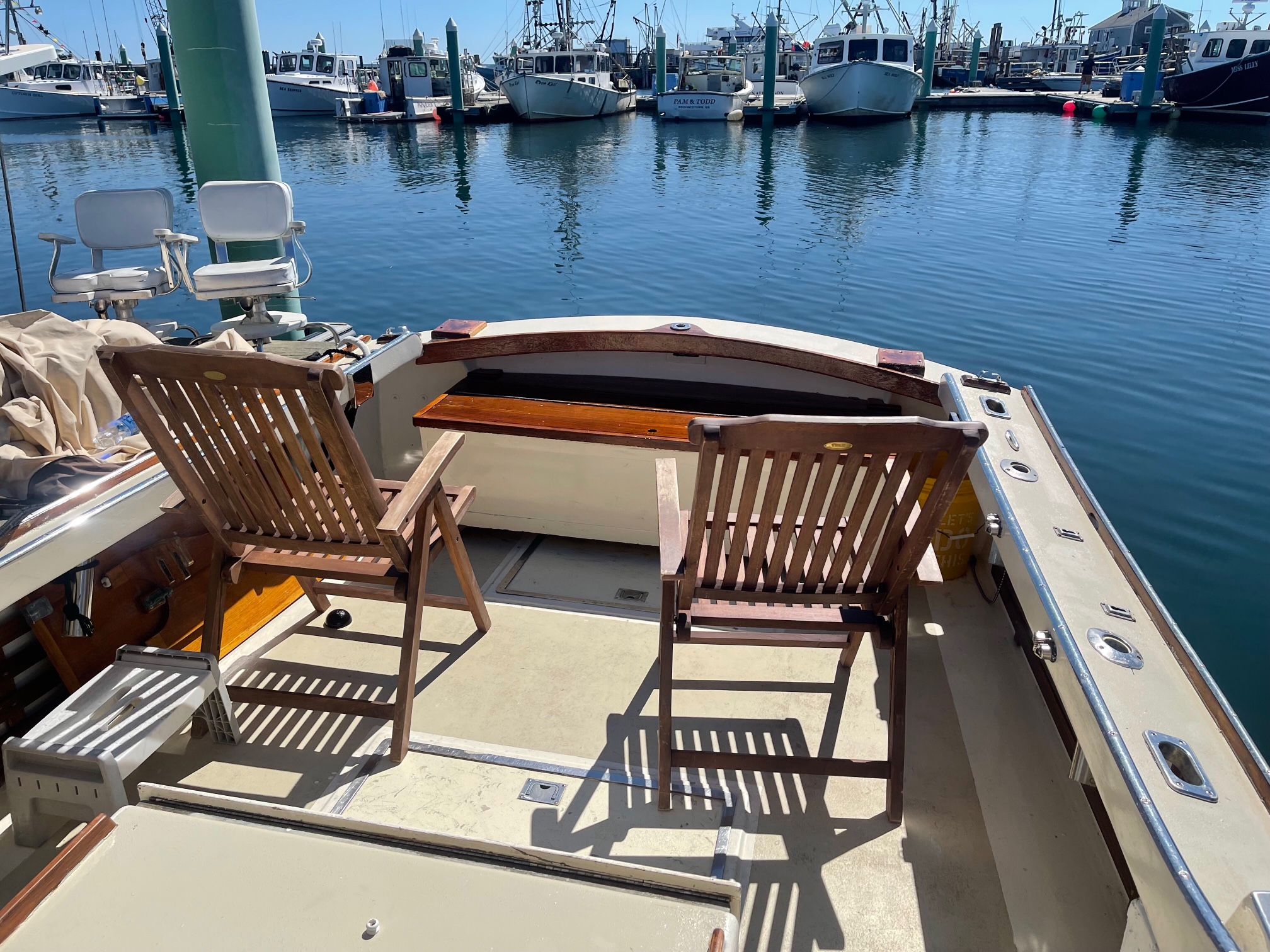 Chair on the deck of Bethie while docked in Provincetown Harbor