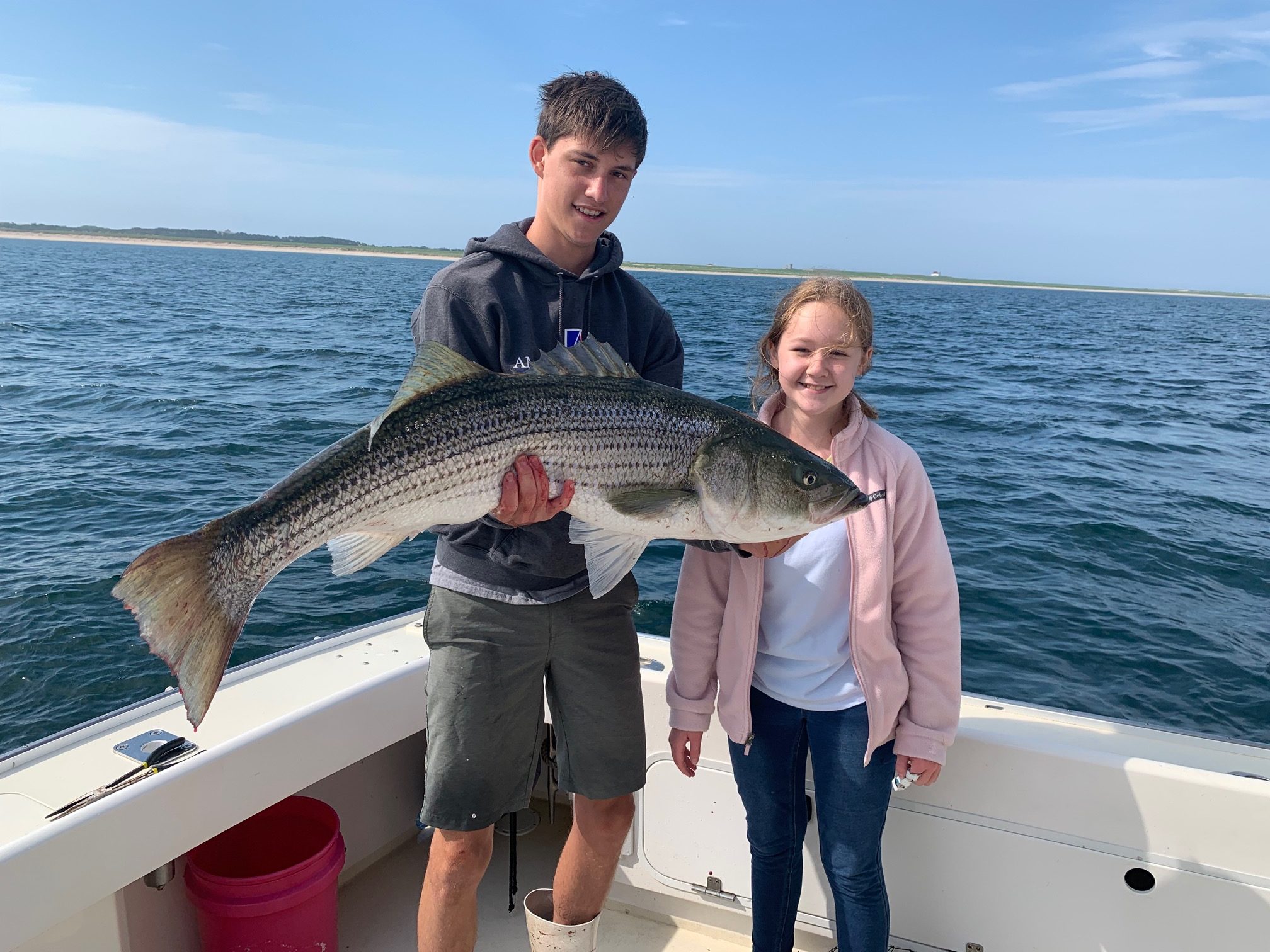 Kids holding a fish caught on the Beth Ann in Provincetown