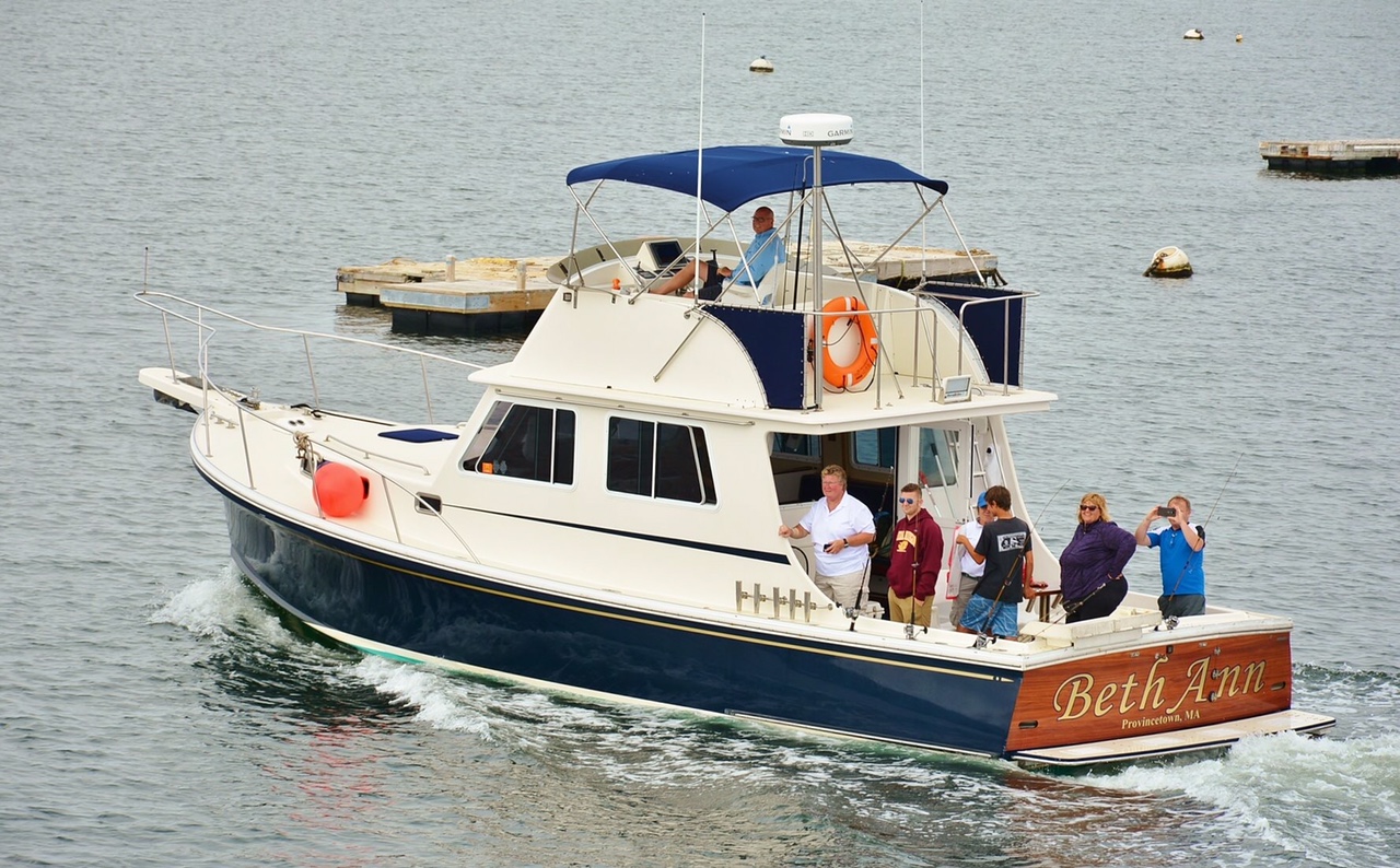 Beth Ann carrying multiple passengers through the harbor in Provincetown